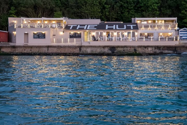 The Hut restaurant lit up in the evening
